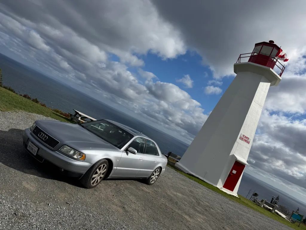 Roci in front of the Cape George Lighthouse, with George again behind the camera
