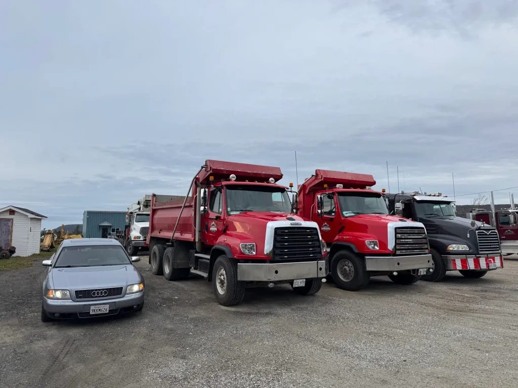 Roci can’t stop socializing with the big trucks…