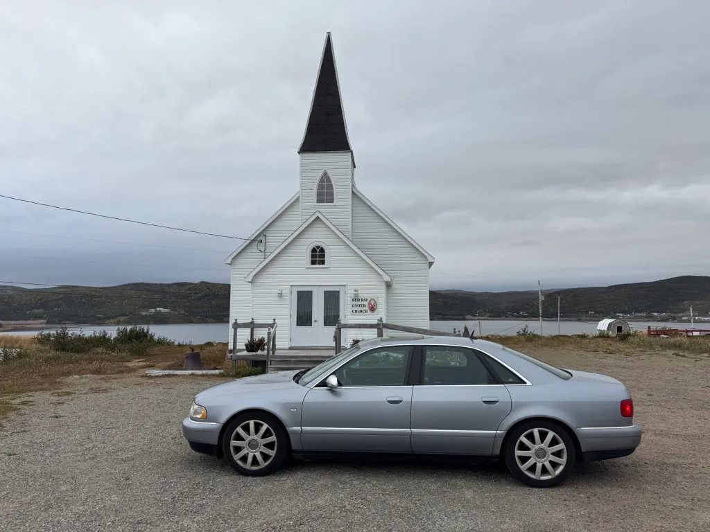 Roci likes churches (Red Bay is quite pretty, btw)