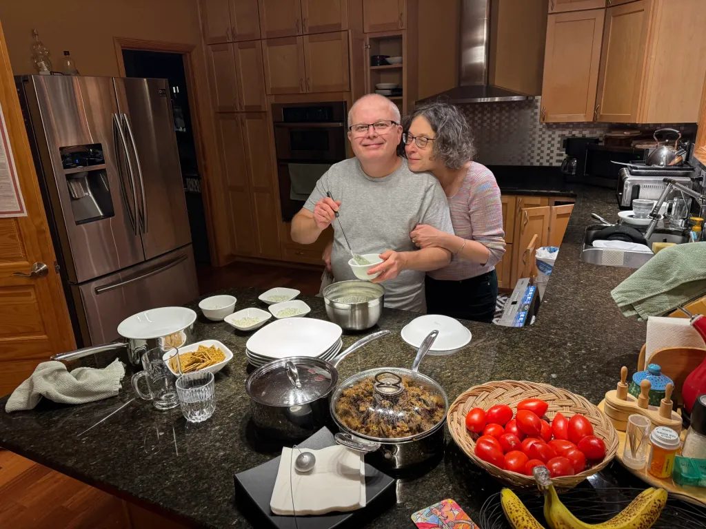 Radu, aka RDK for the initiated, is channeling his inner Cheshire Cat, pointing to the goodies almost ready for gorging on… under Mony’s watchful eye for quality control!